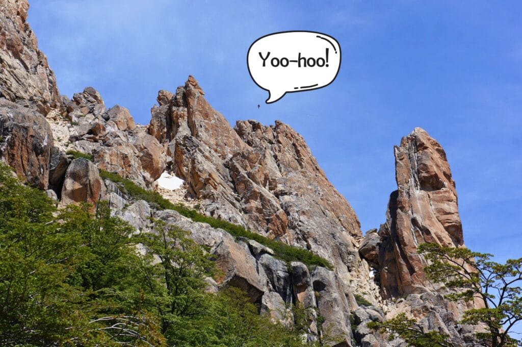 climber on a slackline at the top of a peak at the Frey refuge