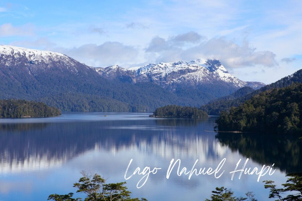 lake nahuel huapi in front of snow-capped peaks